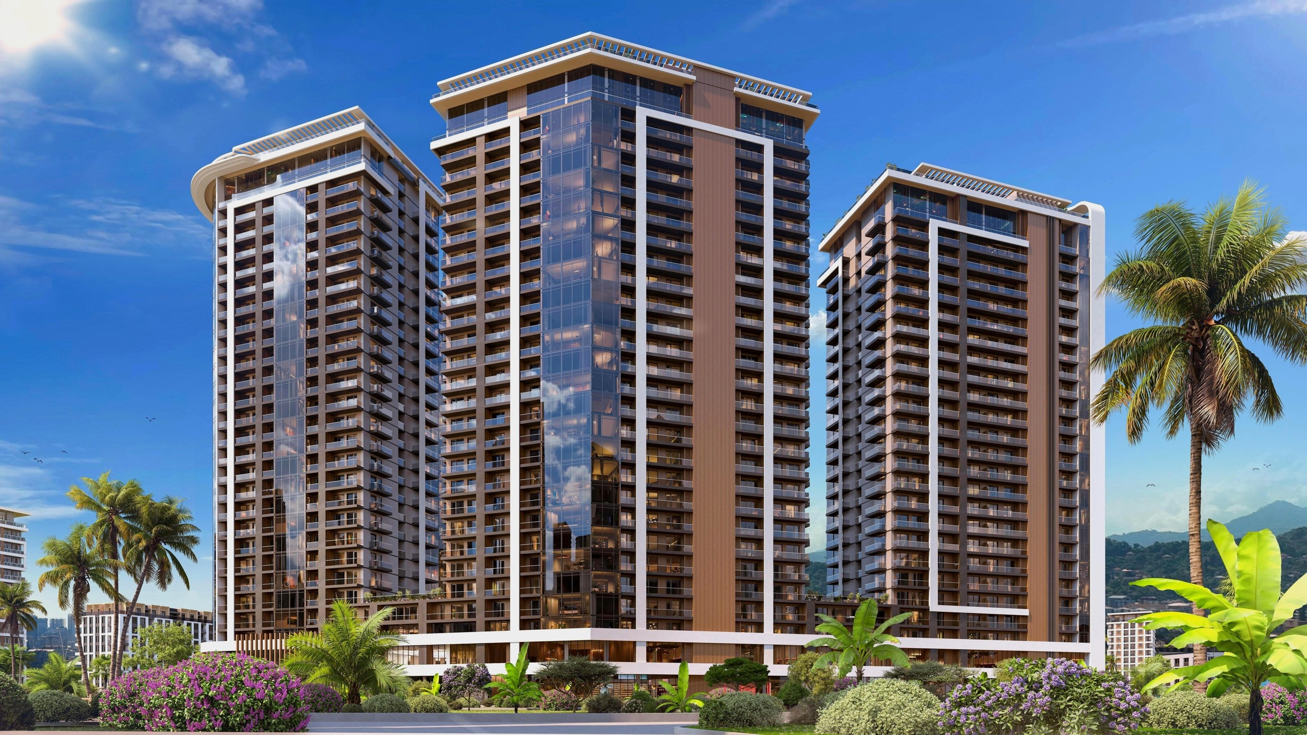 Реалистичный 3D-рендер экстерьера жилого комплекса, состоящего из трех высотных зданий с панорамным остеклением и благоустроенной территорией с пальмами.