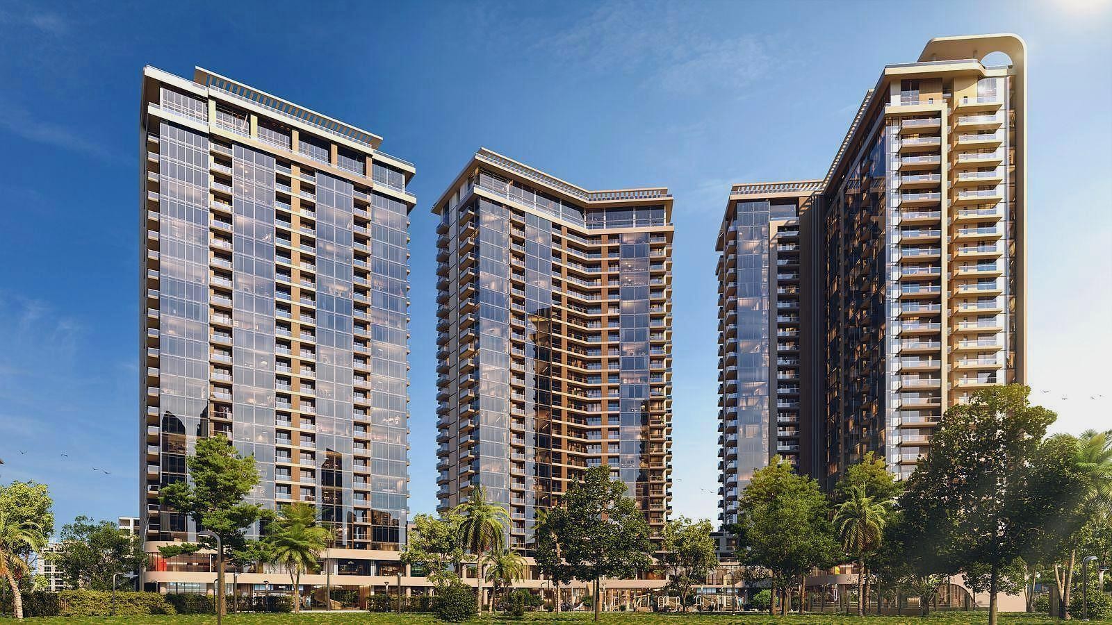 Архитектурная 3D-визуализация современного жилого комплекса, состоящего из трех высотных зданий с панорамным остеклением в окружении зелени.