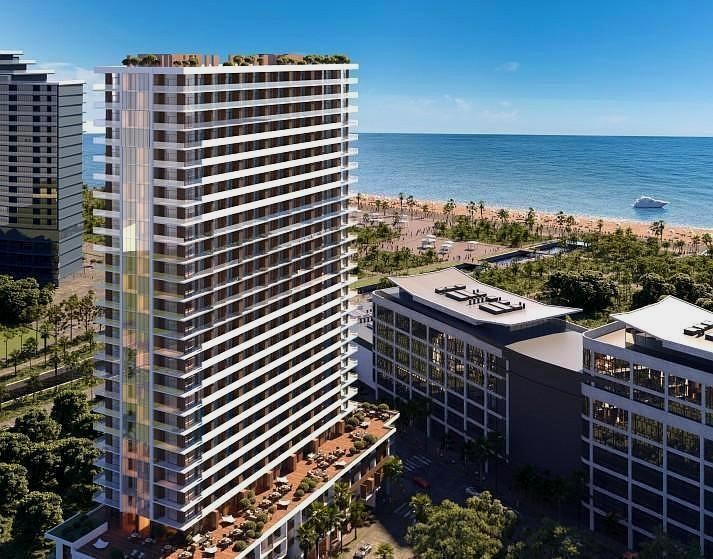 3D-визуализация высотного жилого комплекса, расположенного на первой береговой линии рядом с пляжем и морем.